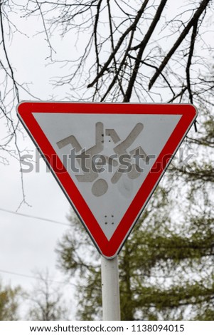 The sign "give way" is made from an inverted sign "cautiously children"