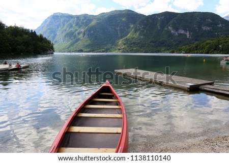 shore of a mountain lake at the foot of the Alps