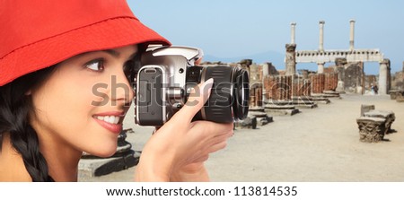 Tourist woman with a camera. Italy vacation.