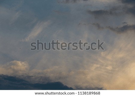 Dramatic sunset sky with clouds. Colorful sunset. Background at dark sky