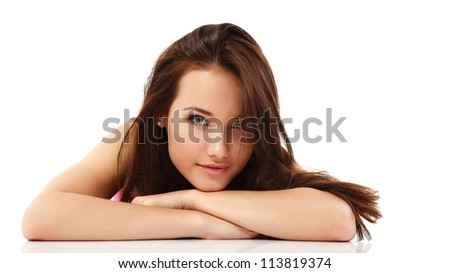 young woman beautiful cheerful lying and looking at camera isolated on white background