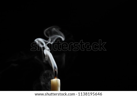 candlelight form abstract smoke over black background Royalty-Free Stock Photo #1138195646