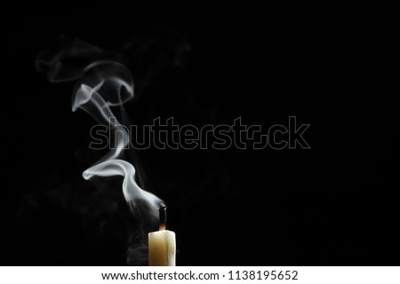candlelight form abstract smoke over black background Royalty-Free Stock Photo #1138195652
