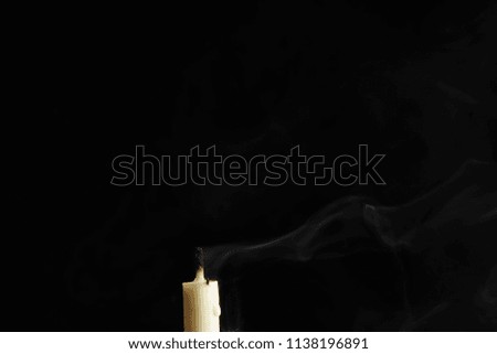 candlelight create abstract smoke over black background