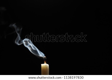 candle and abstract smoke over black background Royalty-Free Stock Photo #1138197830