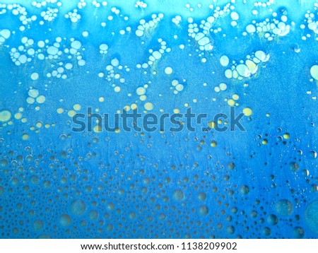 abstract sea blue.abstract art background.oil and water.The movement of beauty between color and oil.