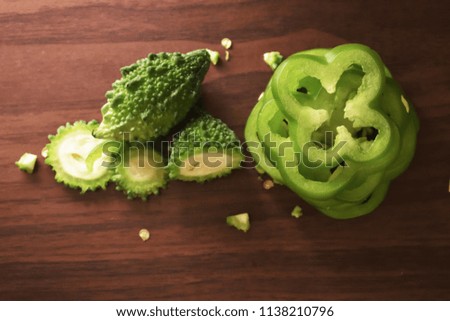 Sliced & Chopped Bitter Gourd  on the wooden background free royalty free stock images