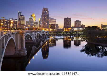 Minneapolis. Image of Minneapolis downtown skyline at sunset. Royalty-Free Stock Photo #113821471