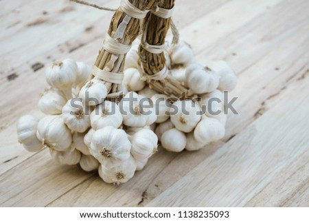 Fresh raw garlic bundle, kitchen raw ingredient concept, copy space