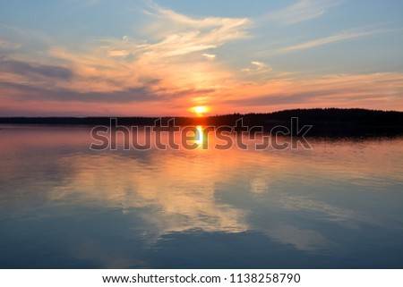 Sunset on the forest lake "Krasavitsa" at Zelenogorsk, Russia