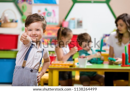 Preschool Children and Teacher in Classroom Royalty-Free Stock Photo #1138264499