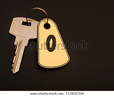 room key on black background with number 0