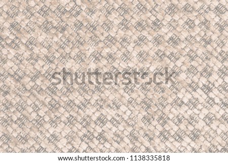 Close up of a woolen fabric of beige color. Abstract background, empty template. Top view.