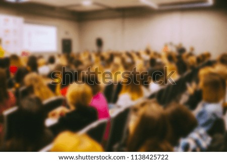 conference. people in the conference room. speech speaker in front of the audience. the audience in the conference room. blurred image / blurred photo. Vintage toning
