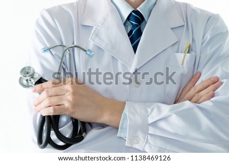 Close up of doctor holding a stethoscope on white background