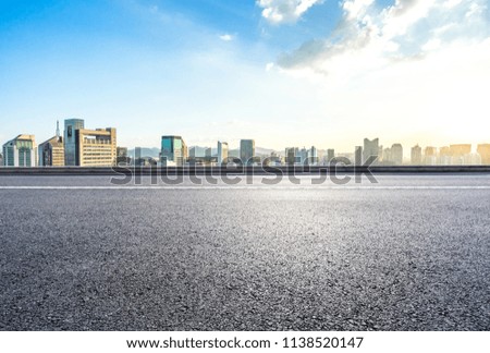 empty asphalt road with panoramic city skyline in hangzhou china