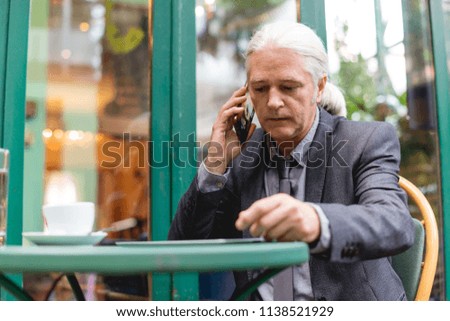 Senior Businessman Having a coffee break