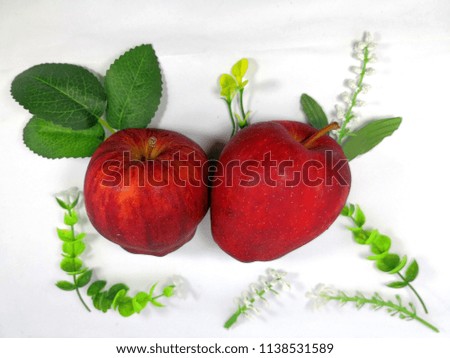 apple with leaves and flower isolated on white background.