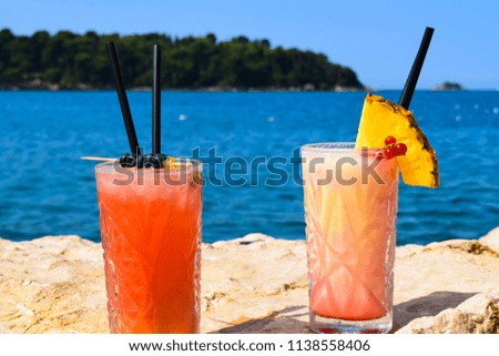 Two Exotic Cocktails By The Beach