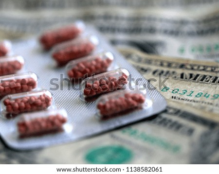 medicines lie on paper denominations American dollars