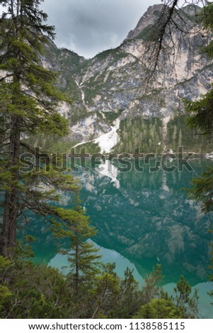 Lake Braies also known as Lago di Braies. The lake is surrounded by the mountains which are reflected in the water.1st point of the trekking route Alta Via 1, The Dolomites, Alps, South Tyrol, Italy