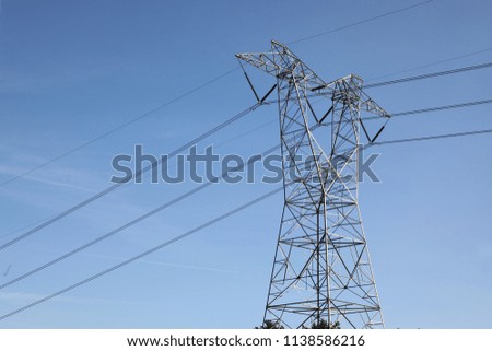 The high voltage pole in blue sky at USA.