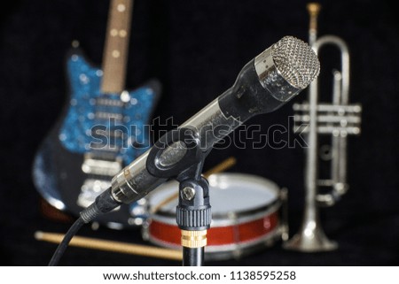 Old microphone. Mic or mike was professionaly used in sixties of the twentieth century in radio stations, concert halls, audio engineering, sound recording.