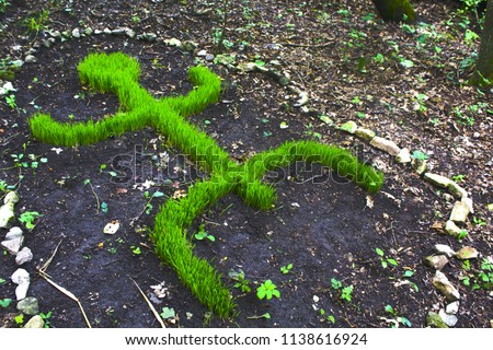 green grass shape of man, ethnic totem idol