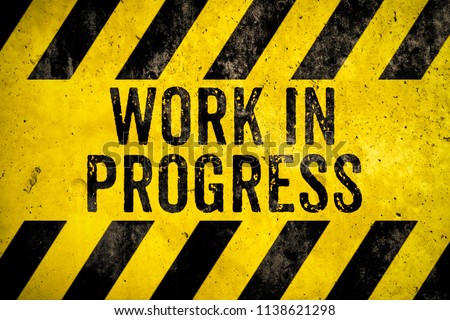 Work in progress warning sign text with yellow and black stripes painted over concrete wall cement texture background. Concept for do not enter the area, caution, danger, construction site. Royalty-Free Stock Photo #1138621298