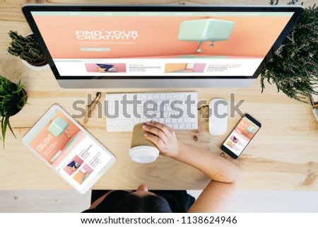 overhead view of woman drinking coffee and devices showing responsive tutorials website design