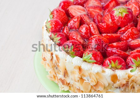 cake with fresh strawberries with almonds slices Royalty-Free Stock Photo #113864761
