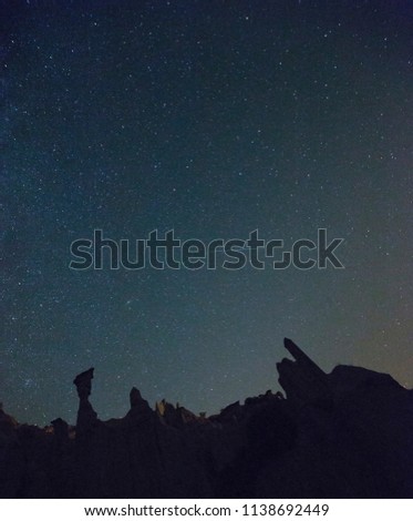 Milky way landscape with falling star