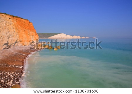 Seven Sisters chalk cliffs East Sussex uk with clear blue turquoise sea 
