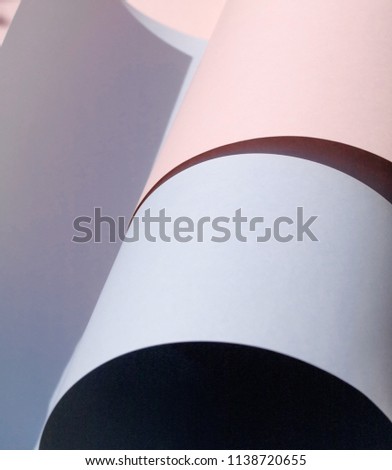 Abstract background in light pastel blue and pink. Paper rolls. Copy space