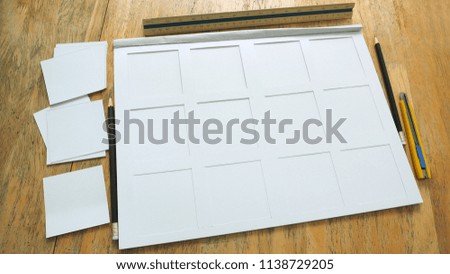 White paper frame 200gsm texture in book with stationary item and cutting rectangular has stationary are pencil, cutter ruler, scale ruler on the desk, Art work, homework, job concept.