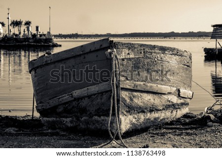 Fisherman's boat at rest, vintage Royalty-Free Stock Photo #1138763498