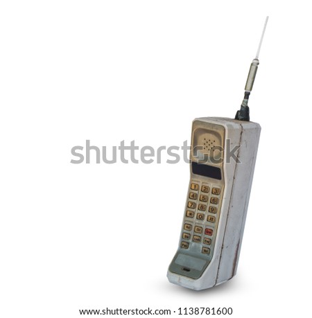 Close up rustic vintage mobile phone isolated on white background Royalty-Free Stock Photo #1138781600
