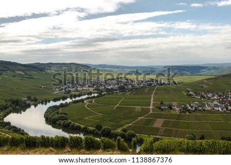 Taking a walk on a trail above the river moselle. Spectacular view over a beautiful landscape. This picture was taken at the river bend in Traben-Trabach near Trier and Bernkastel-Kues in Germany.
