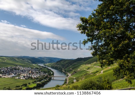 Taking a walk on a trail above the river moselle. Spectacular view over a beautiful landscape. This picture was taken at the river bend in Traben-Trabach near Trier and Bernkastel-Kues in Germany.