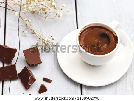 Turkish coffee with chocolate on white background.