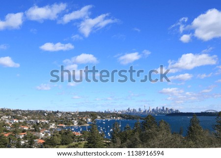City views of sydney with harbour bridge and houses