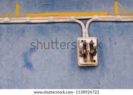 The old switch with old wiring on top, currently not in use.