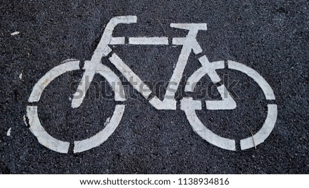Bicycle sign on street surface. Bicycle lane for bike rider. 
