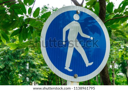 Blue traffic sign. Traffic signs are only for pedestrians.
