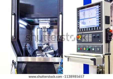 CNC machine control panel. Shallow depth of field. Royalty-Free Stock Photo #1138985657