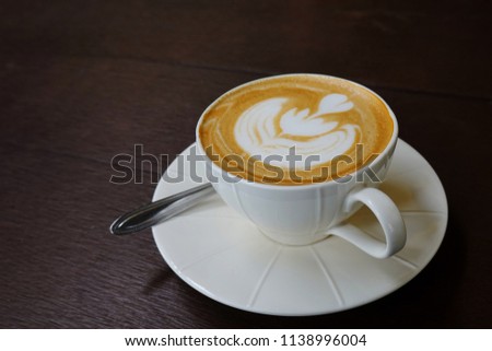 Latte art. The hot coffee with milk in graphic of picture.