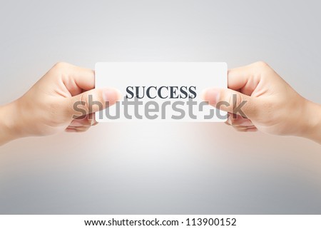  Hand of women holding sale paper label or tag on white background
