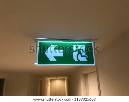 Fire exit signs display information which informs people where they should go in the event of a fire or other emergency.