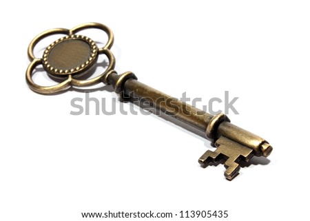 Isolated bronzed metal key used for locking and unlocking
