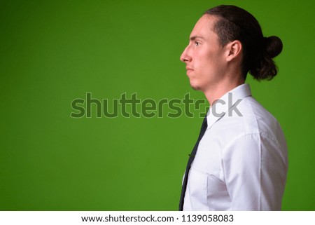 Profile view of young handsome businessman